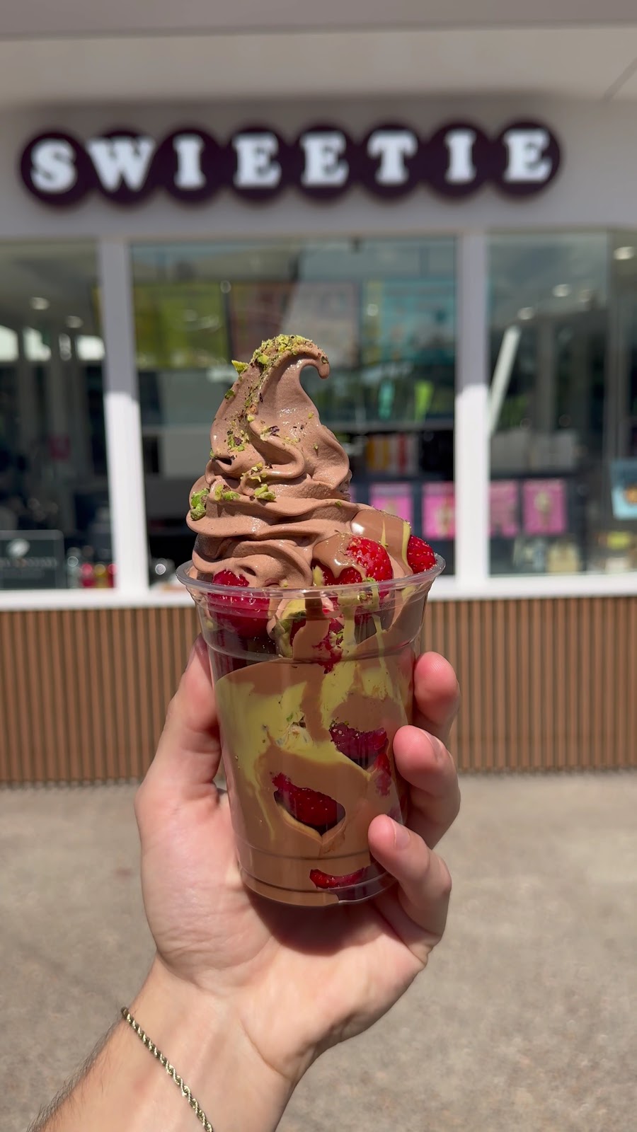 Dubai Strawberry Cup with chocolate soft serve, pistachio and strawberries