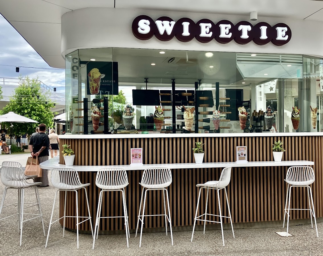 The SWIEETIE kiosk with its timber slat counter and white stools